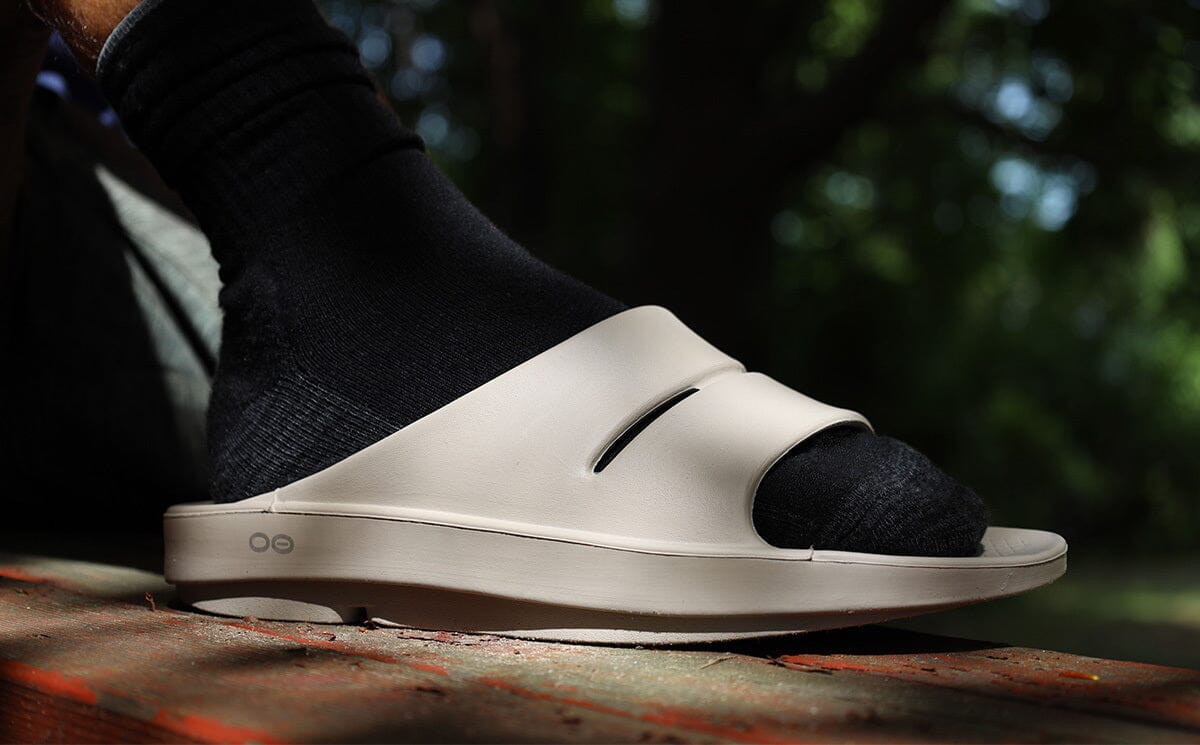 Men's OOahh Slide Sandal - Nomad lifestyle close up image of side of shoe