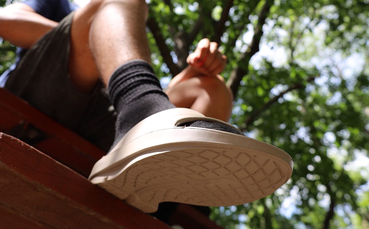 Men's OOahh Slide Sandal - Nomad lifestyle close up image of bottom of shoe