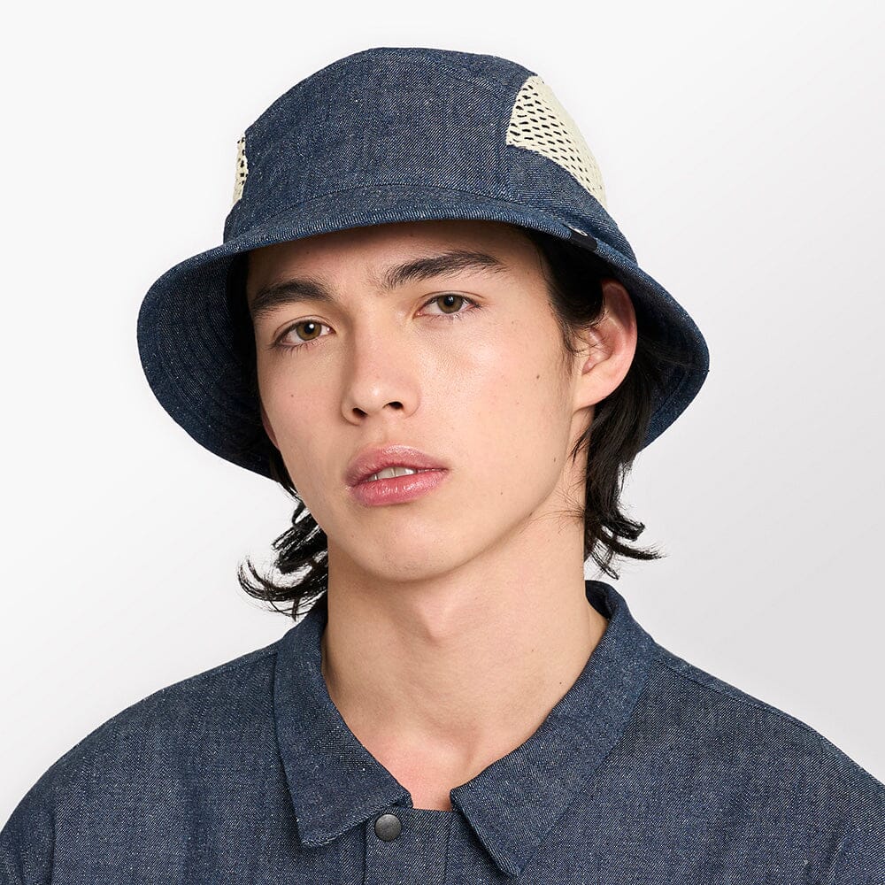 front view of ciele athletics GOBucket unisex running bucket hat from the Lifestyle Edition collection, in denim indigo color, on a model