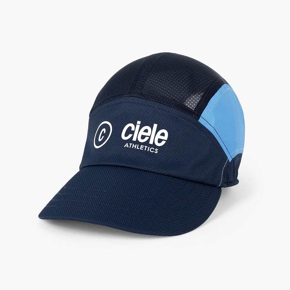 front view of the ciele athletics FTSCap unisex running hat with a curved brim in indigo color