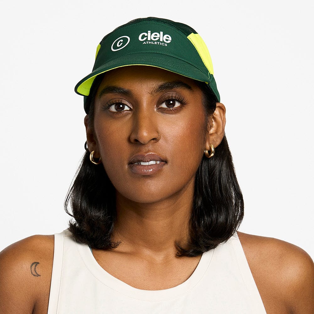 front view of the ciele athletics FTSCap unisex running hat with a curved brim in emerald color