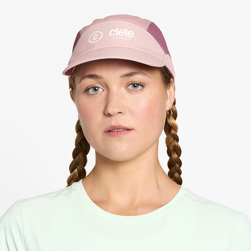 front view of ciele athletics FSTCap SC Classic C Side unisex running hat in peachskin color