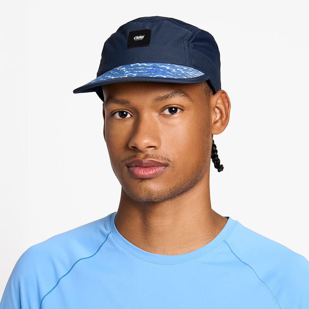 front view of the ciele athletics GOCap unisex running hat in indigo color