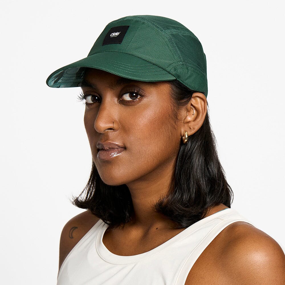 front view of the ciele athletics FTSCap unisex running hat with a curved brim in emerald color