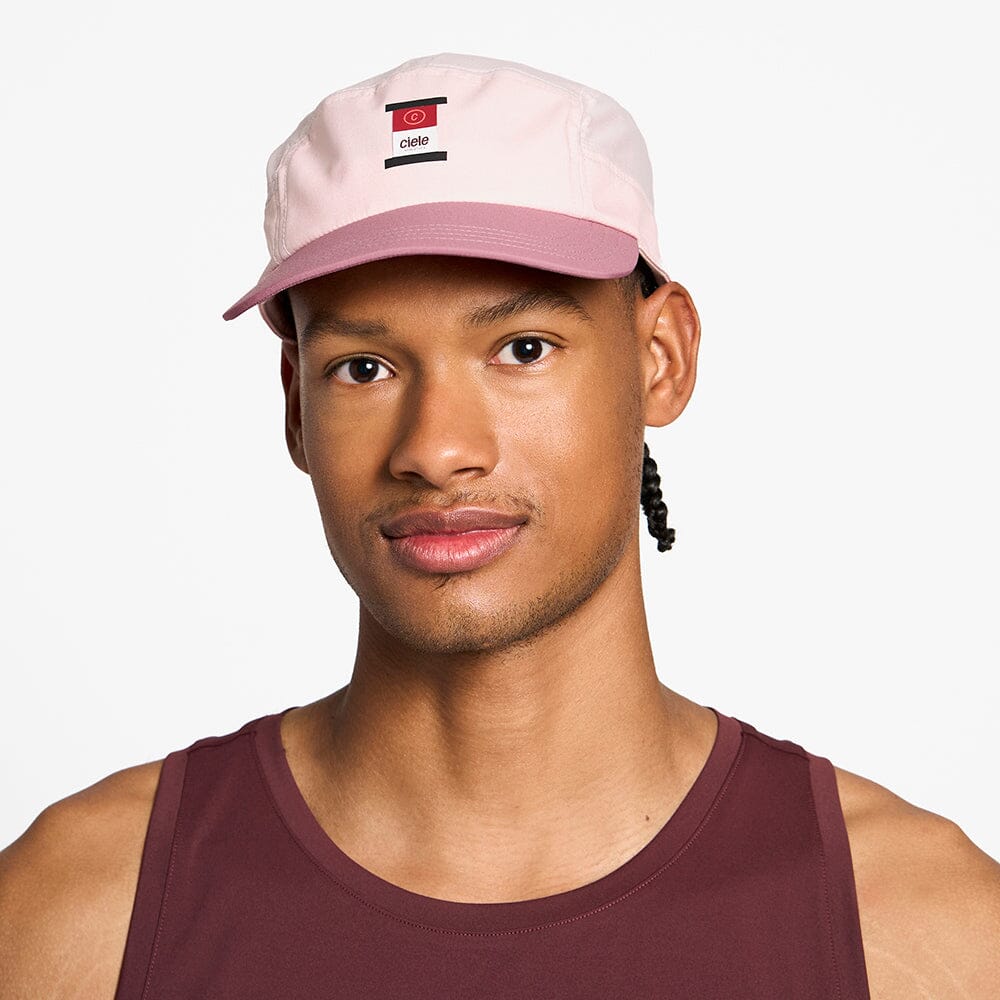 front view of the ciele athletics GOCap with a curved brim unisex running hat in peachskin color