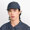 front view of ciele athletics CRWCap short brim unisex running hat with shorter brim from the Lifestyle Edition collection, in denim indigo color, on a model