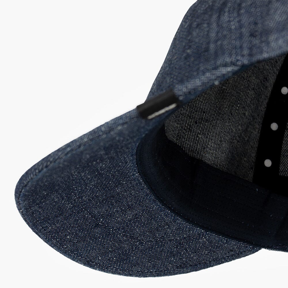 detail underbrim view of ciele athletics CRWCap short brim unisex running hat with shorter brim from the Lifestyle Edition collection, in denim indigo color